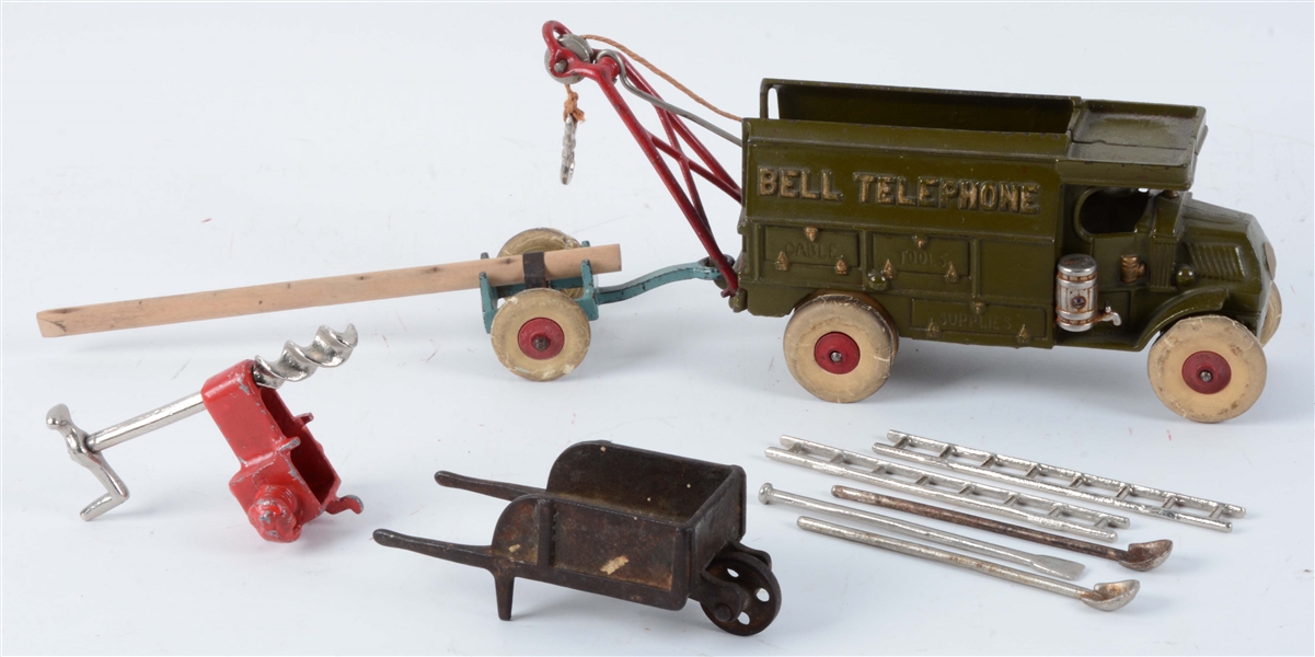 LOT OF 2: CAST IRON BELL TELEPHONE TRUCK AND LOG TRAILER.