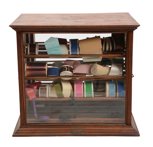 RUSSELL & SONS COUNTRY STORE RIBBON DISPLAY CASE.