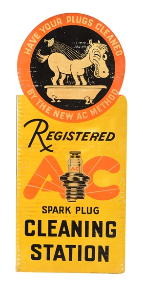 NEW OLD STOCK AC SPARK PLUGS CLEANING STATION TIN FLANGE SIGN WITH DONKEY & SPARK PLUG GRAPHIC.
