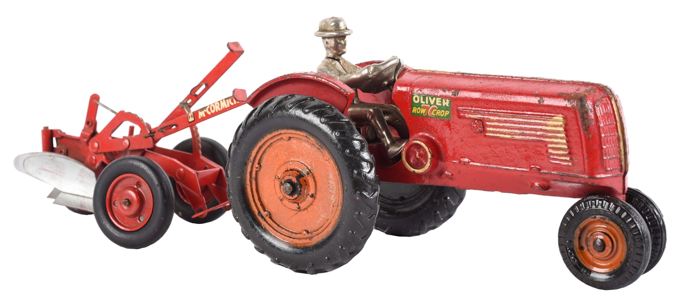 CAST IRON ARCADE OLIVER ROW CROP TOY TRACTOR PULLING FARM EQUIPMENT.