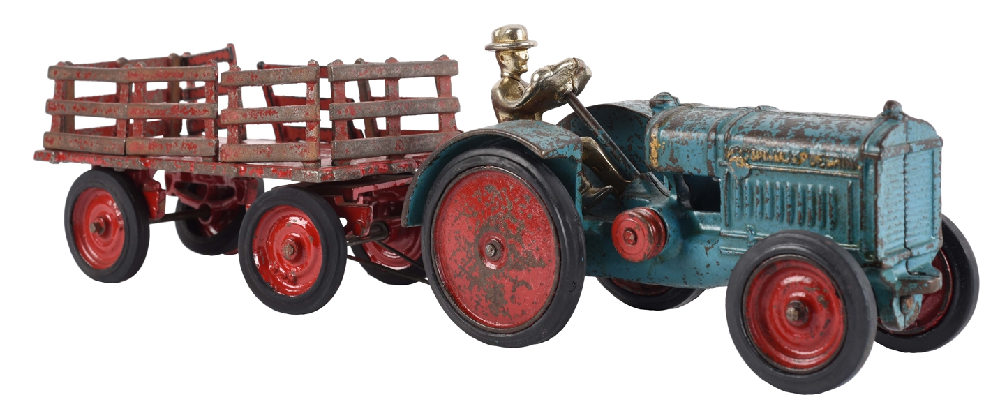 CAST IRON ARCADE DISK WHEEL TOY TRACTOR PULLING STAKE-BACKED WAGON.