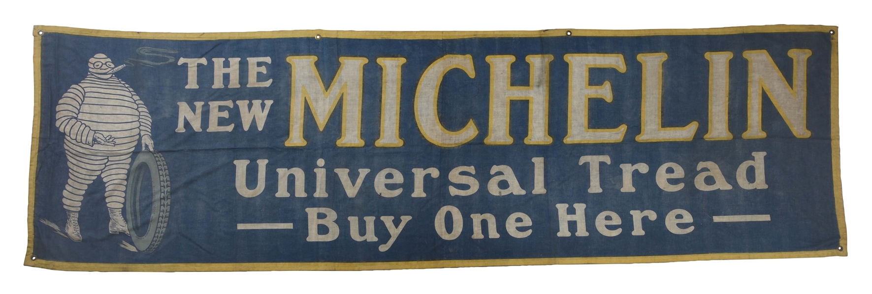 MICHELIN THE UNIVERSAL TREAD CLOTH BANNER WITH EARLY BIBENDUM GRAPHIC.