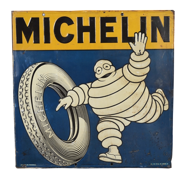 MICHELIN TIRES EMBOSSED TIN SIGN WITH BIBENDUM & TIRE GRAPHIC. 