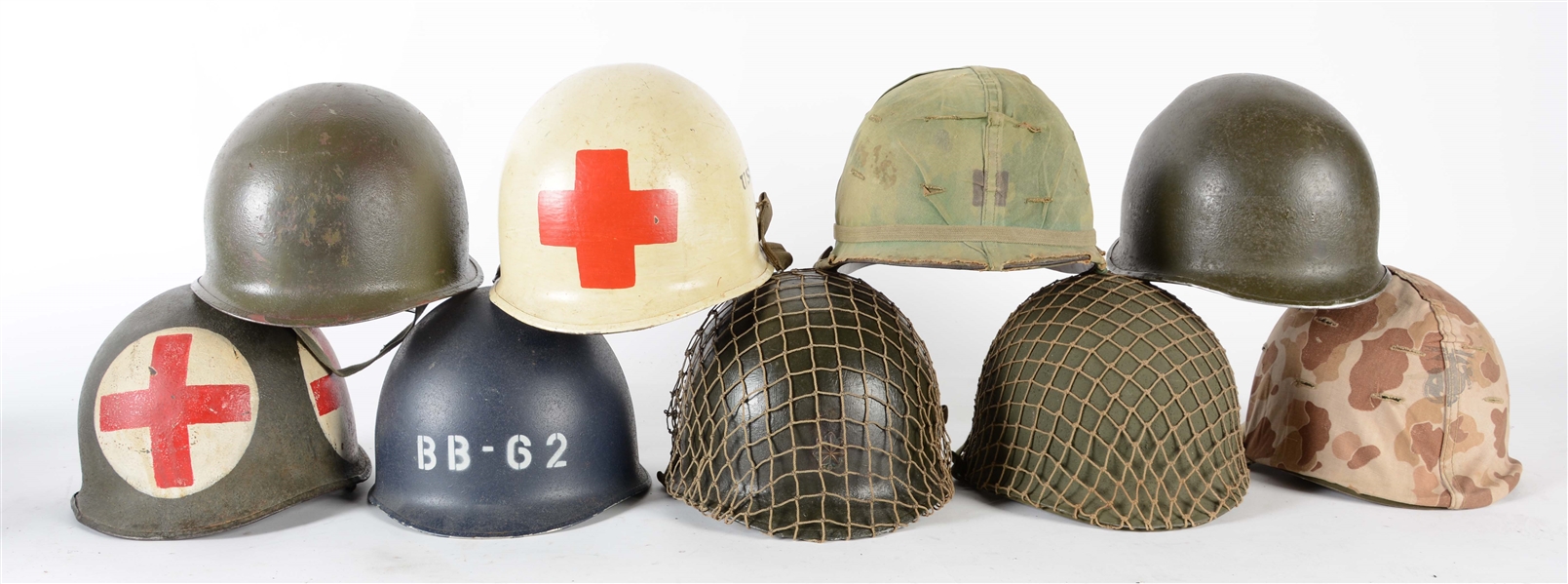 LARGE LOT OF U.S. M1 HELMETS OF VARIOUS AGES.