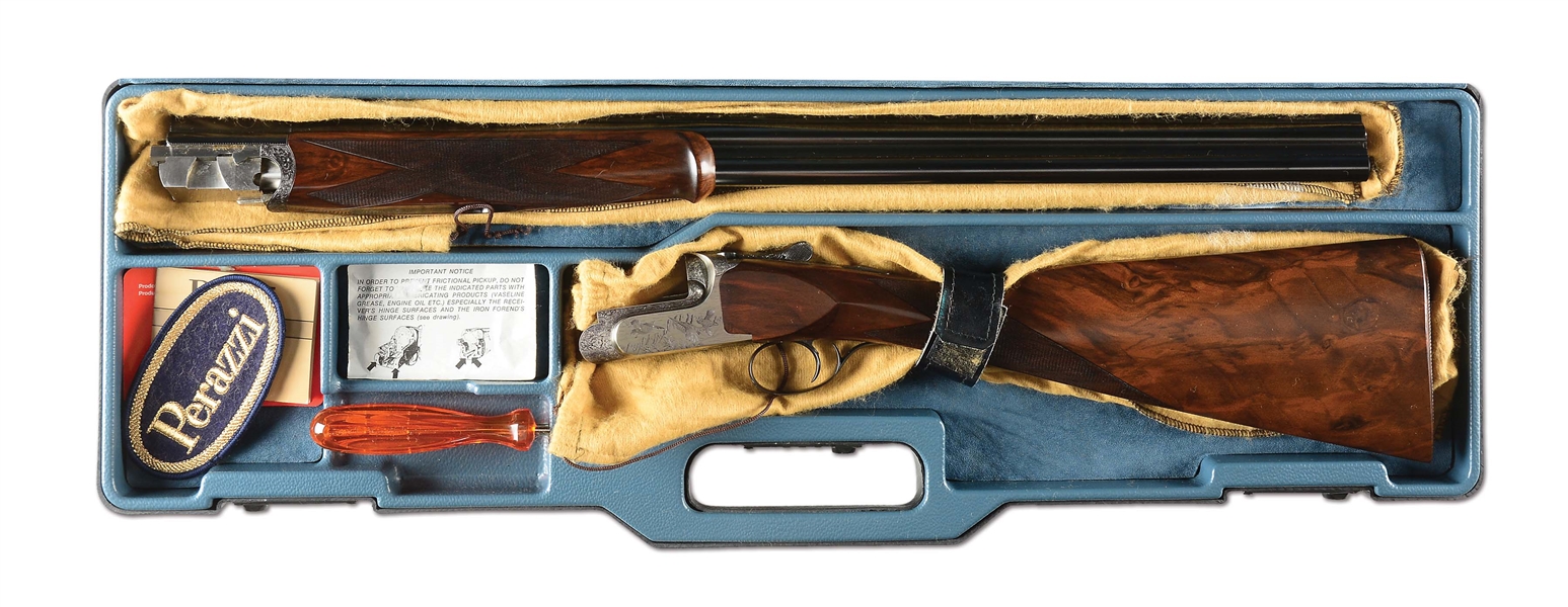 (M) SCARCE PERAZZI 20 GAUGE SCO OVER-UNDER GAME SHOTGUN WITH FINE FLORAL AND SCROLL ENGRAVING AND INTERESTING BULINO GAME SCENE WITH CASE.