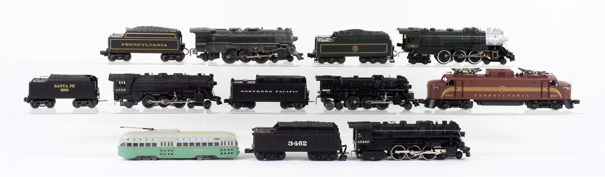 LOT OF 11: LIONEL LOCOMOTIVES TWO WITH BOXES & CORGI BUS. 