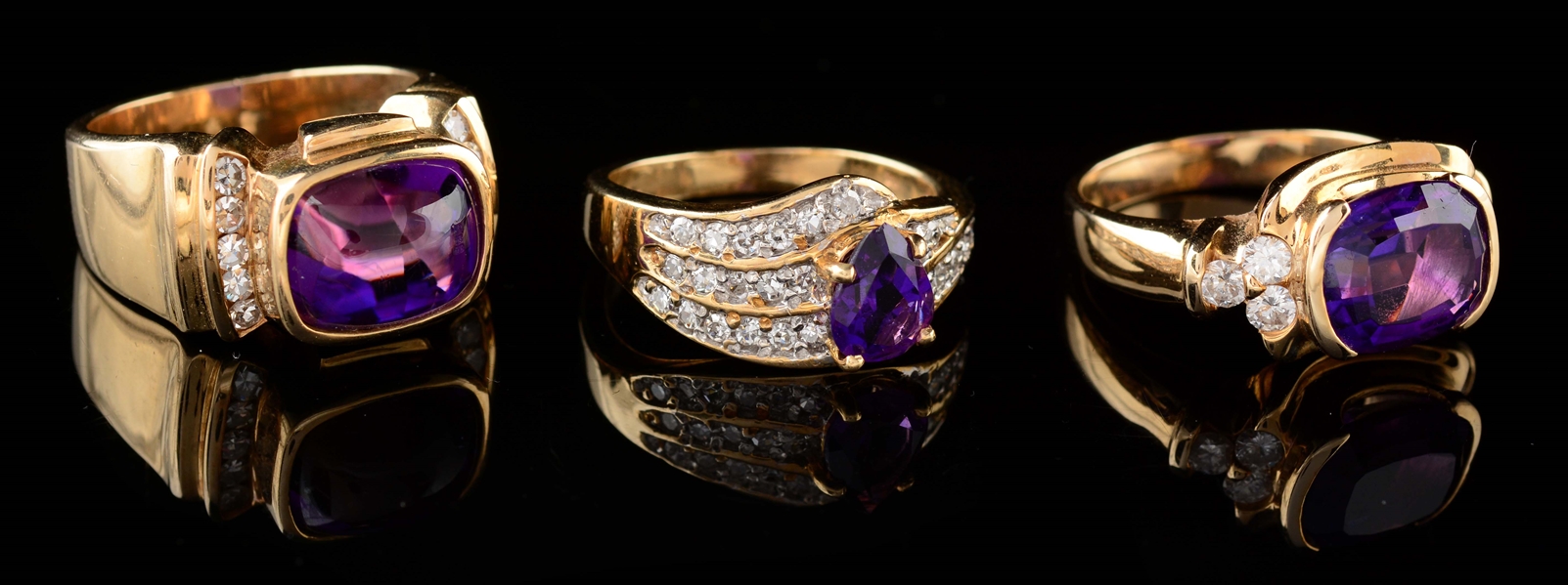 LOT OF 3: YELLOW GOLD AMETHYST AND DIAMOND RINGS.
