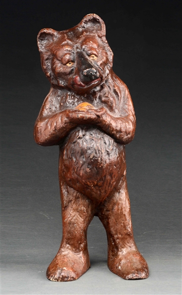 CAST IRON STANDING HONEY BEAR DOORSTOP. 