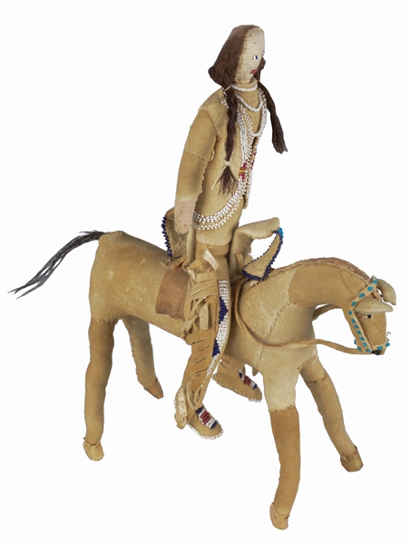 CROW INDIAN WARRIOR DOLL ON HORSE.