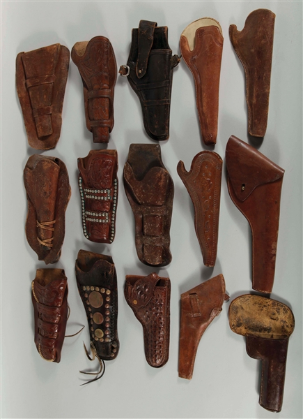 LOT OF 15: ANTIQUE WESTERN HOLSTERS.