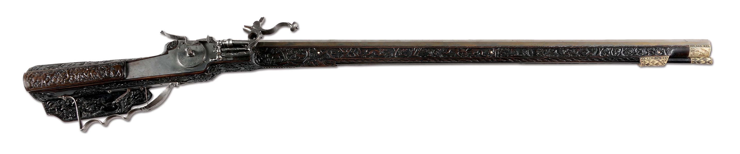(A) MAGNIFICENT AND SPLENDID GERMAN WHEELOCK SPORTING RIFLE LAVISHLY AND ELABORATELY CARVED THROUGHOUT ITS LENGTH BY GEORG MAUCHER OF SCHWABISCH GMUND, CIRCA 1660.