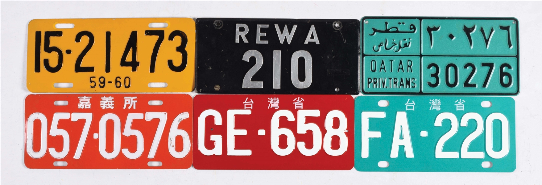 LOT OF 12: MISCELLANEOUS FOREIGN LICENSE PLATES.
