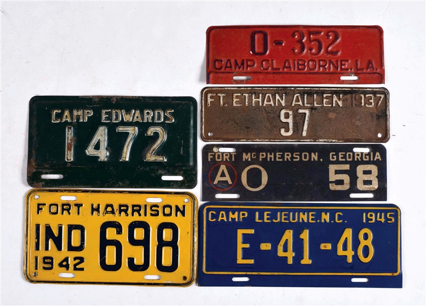 LOT OF 12: MILITARY ATTACHMENT LICENSE PLATES.