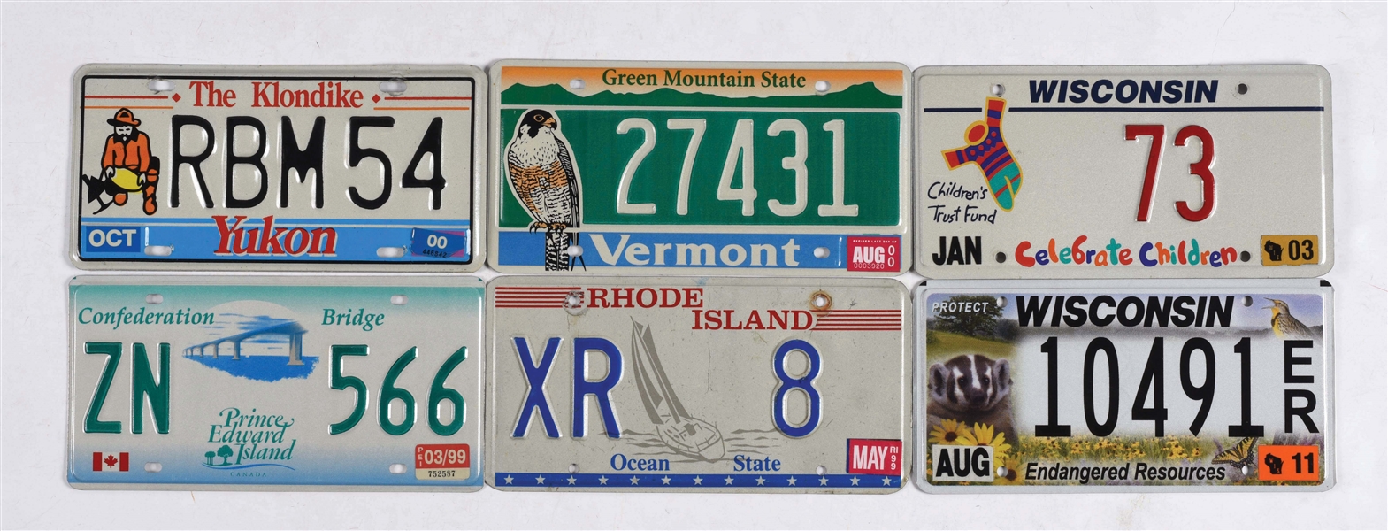 LOT OF 12: MISCELLANEOUS & UNUSUAL GRAPHIC LICENSE PLATES.
