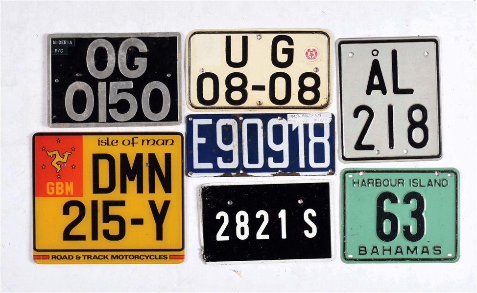 LOT OF 12: VARIOUS FOREIGN MOTORCYCLE LICENSE PLATES.
