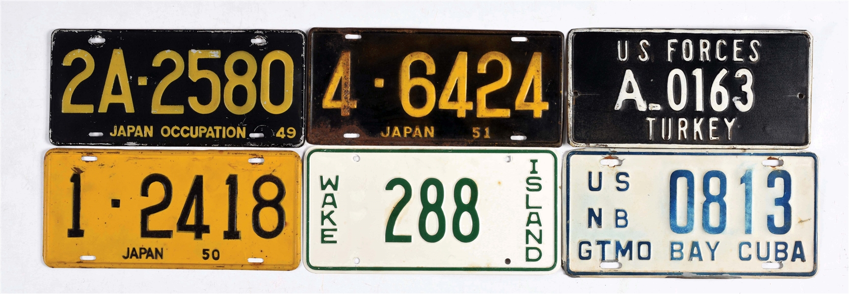 LOT OF 11: U.S. FORCES ABROAD LICENSE PLATES.