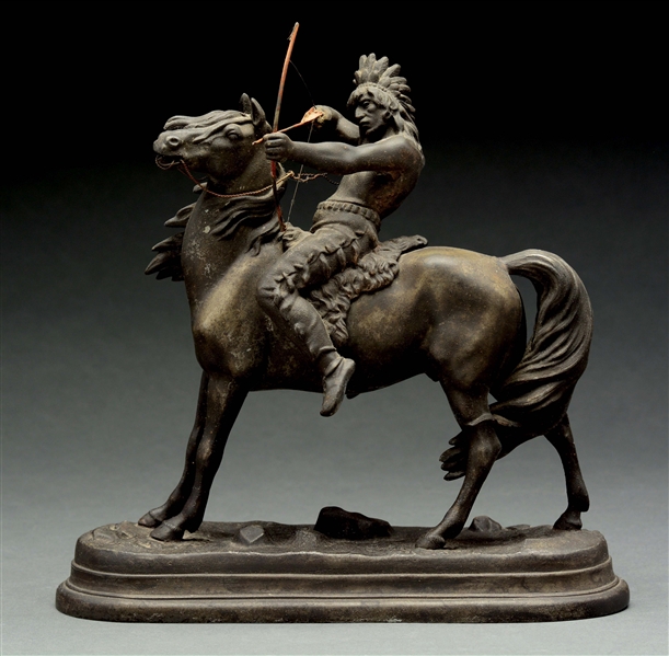 CAST IRON INDIAN ON HORSE STATUE. 