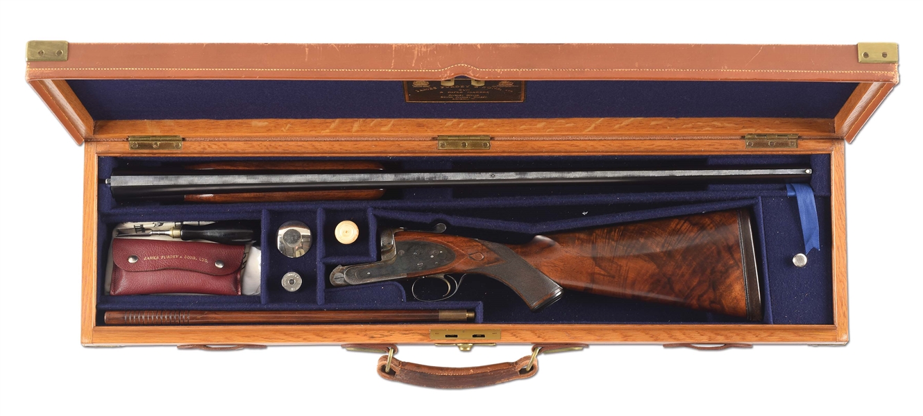 (C) RARE (59 MADE) PURDEY SINGLE BARREL TRAP SHOTGUN WITH CASE AND ACCESSORIES SPECIALLY ENGRAVED AND MADE FOR MARSHALL FIELD & COMPANY.