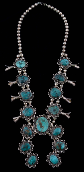 SILVER AND TURQUOISE SQUASH BLOSSOM NECKLACE.