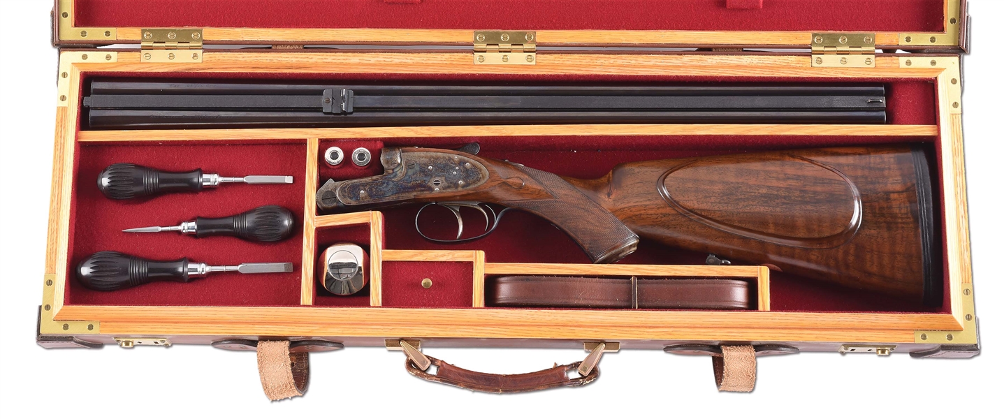 (C) JAMES PURDEY SIDELOCK EJECTOR DOUBLE RIFLE IN .45-70 WITH CASE AND ACCESSORIES.