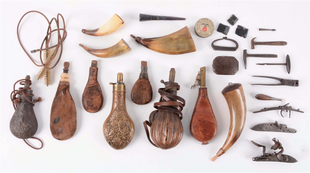 LARGE LOT OF PRIMING HORNS, POWDER FLASKS, POWDER MEASURES, AND OTHER SMALL PARTS.