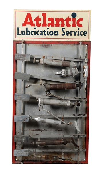 ATLANTIC LUBRICATION SERVICE GREASE GUN RACK WITH EMBOSSED TIN SIGN. 