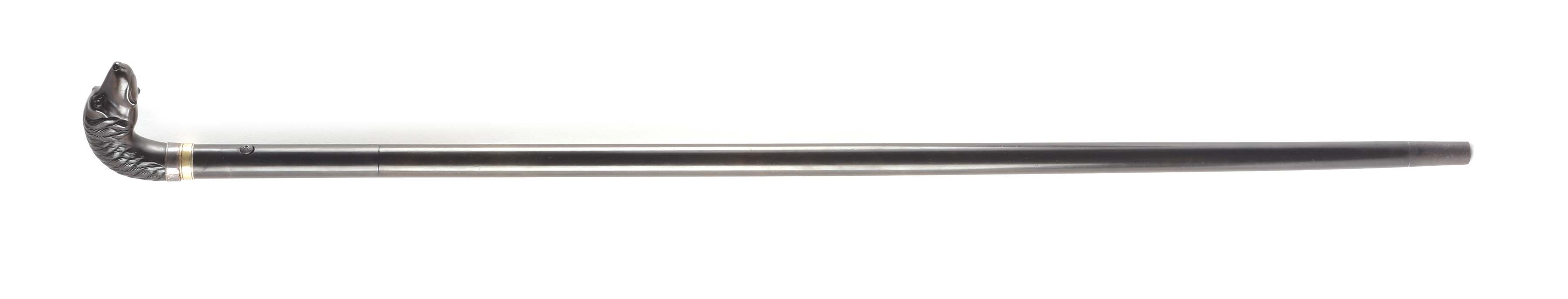(C) A SCARCE AND DESIRABLE REMINGTON RIFLE CANE WITH THE DESIRABLE LARGE DOG HEAD HANDLE IN .32 RIMFIRE, CIRCA 1875.