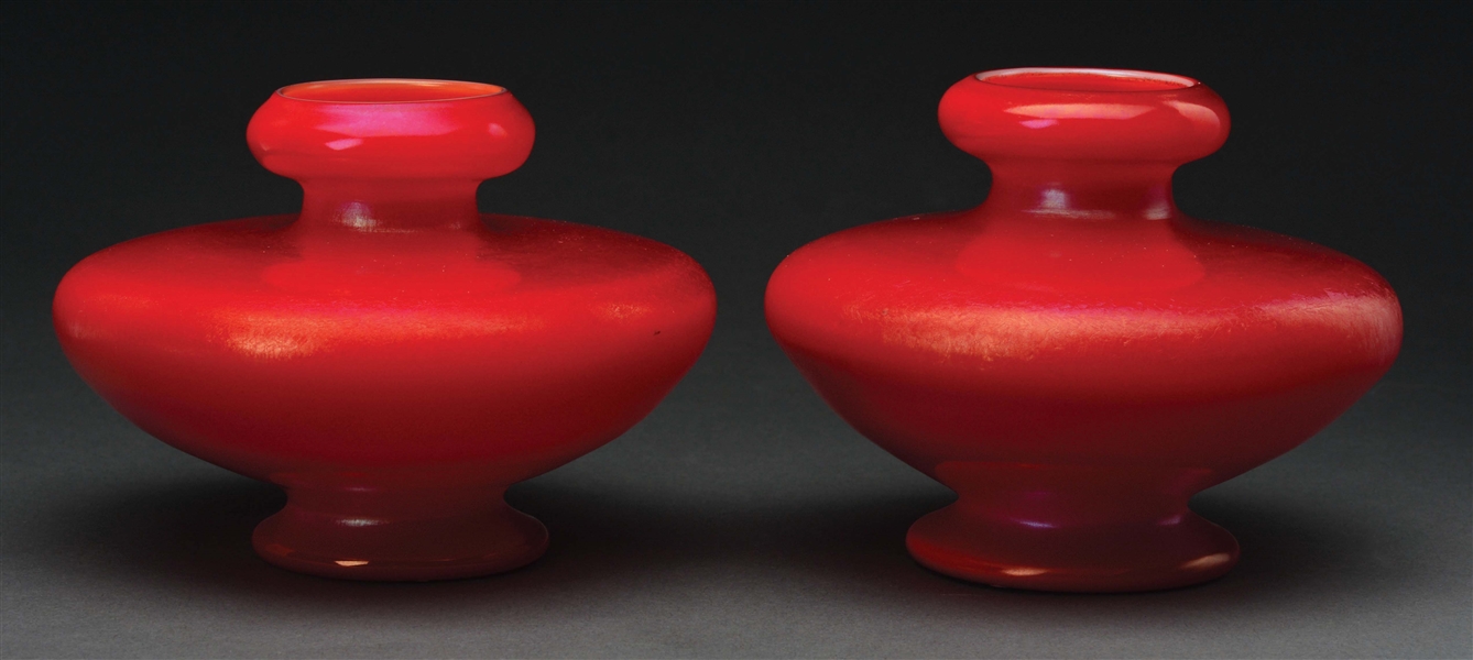 PAIR OF TIFFANY RED FAVRILE VASES.