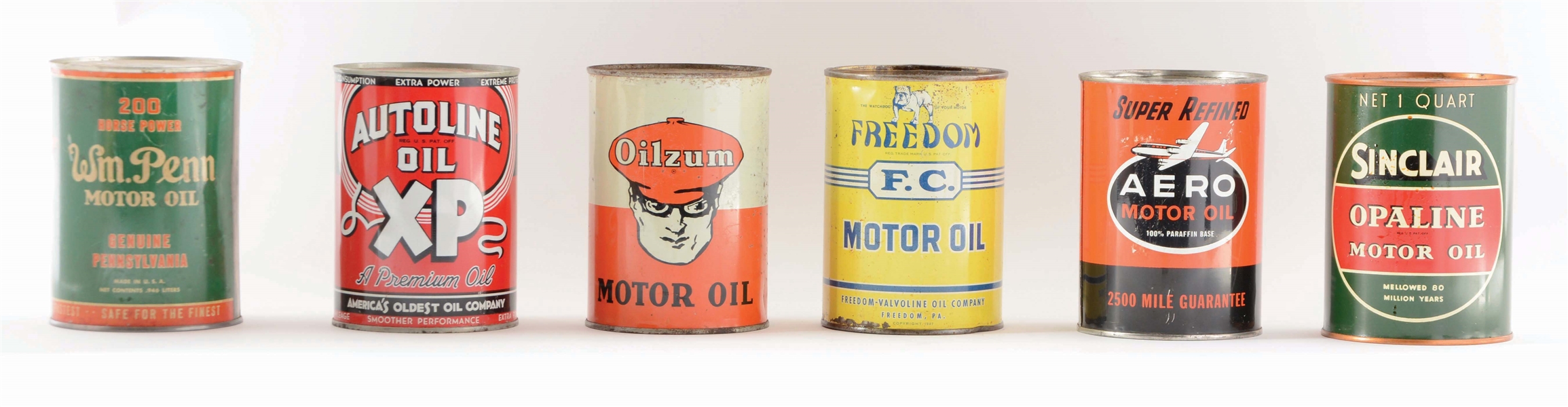LOT OF 6: ONE QUART MOTOR OIL CANS.