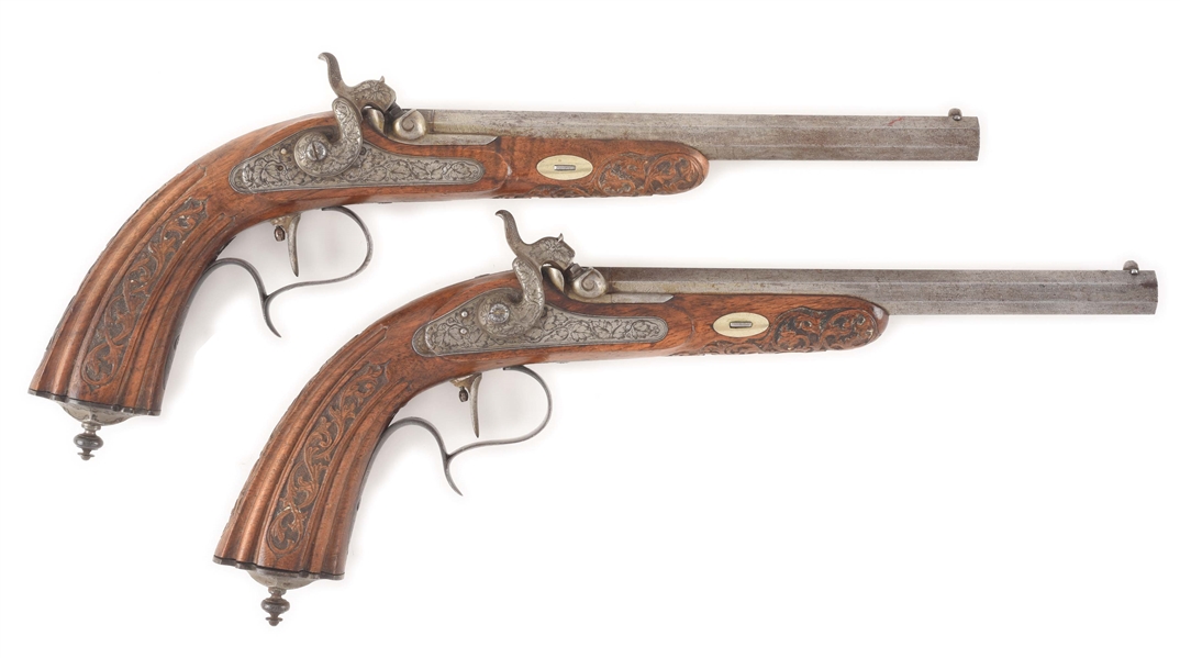 (A) A FINE PAIR OF BELGIAN PERCUSSION TARGET/DUELING PISTOLS SIGNED BY E.F. GRUNDMANN IN OLDENBURG.