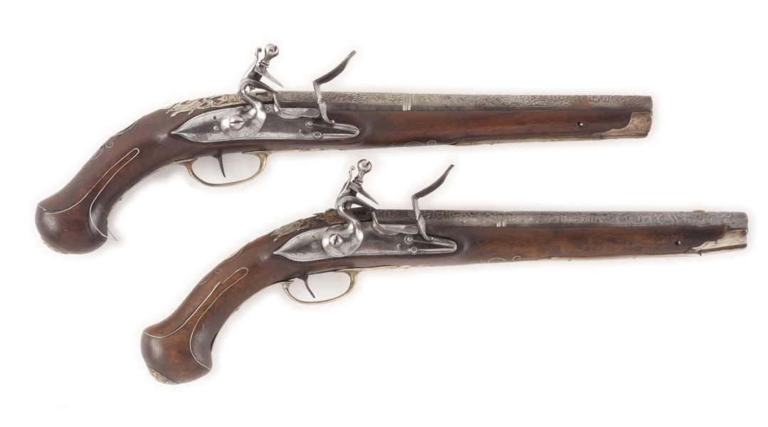 (A) PAIR OF SILVER MOUNTED OTTOMAN HOLSTER PISTOLS CIRCA 1820 WITH FINELY ENGRAVED LOCKS AND ROLLER BEARING FRIZZENS.