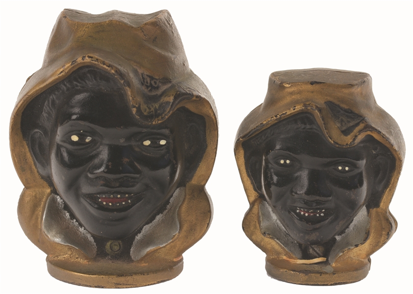 LARGE TWO FACED BLACK BOY AND SMALL TWO FACED BLACK BOY CAST-IRON STILL BANKS. 