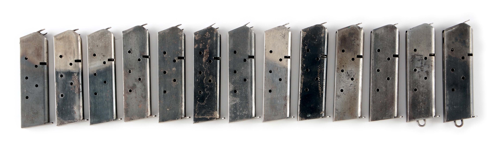 LOT OF 13: COLT MODEL 1911A1 MAGAZINES FEATURING "KEYHOLE" EXAMPLE.