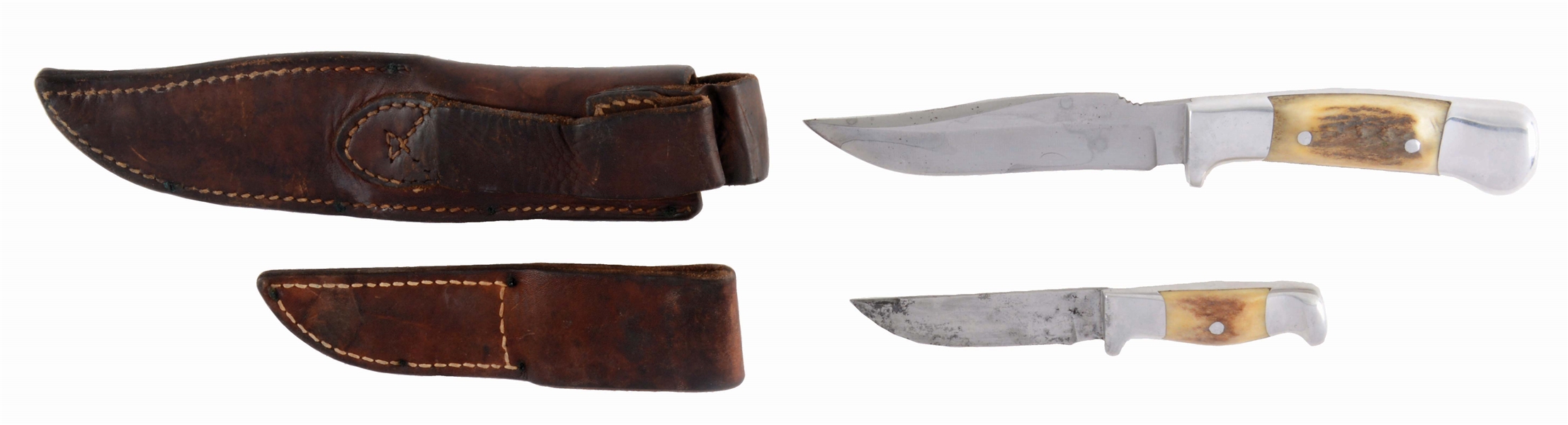 PAIR OF R.H. RUANA HUNTING KNIVES WITH SCABBARDS.