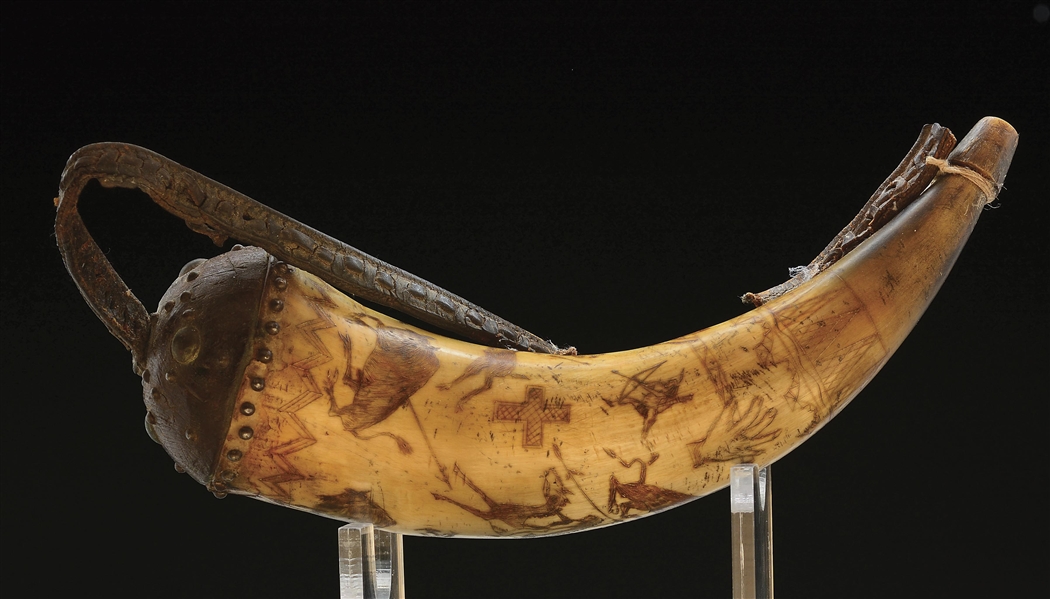 UNIQUE AND EXTREMELY RARE ENGRAVED POWDER HORN DEPICTING AN INDIAN BUFFALO HUNT AND DECORATED WITH TACKS.