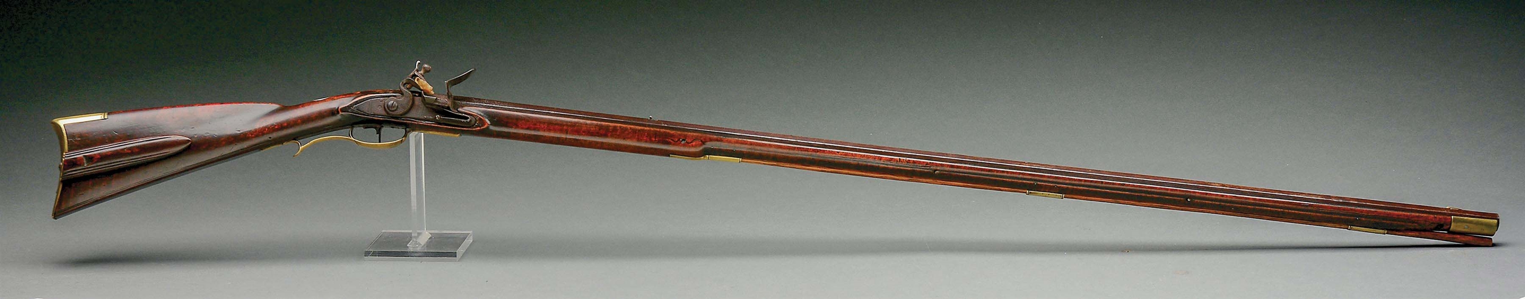 (A) CARVED FLINTLOCK RIFLE ATTRIBUTED TO LEONARD REEDY WITH RARE SLIDING WOODEN PATCHBOX.