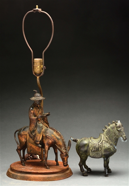 BRONZE TANG STYLE HORSE TOGETHER WITH A POT METAL FIGURE OF A TRAVELER ON HORSEBACK NOW MOUNTED AS A LAMP.