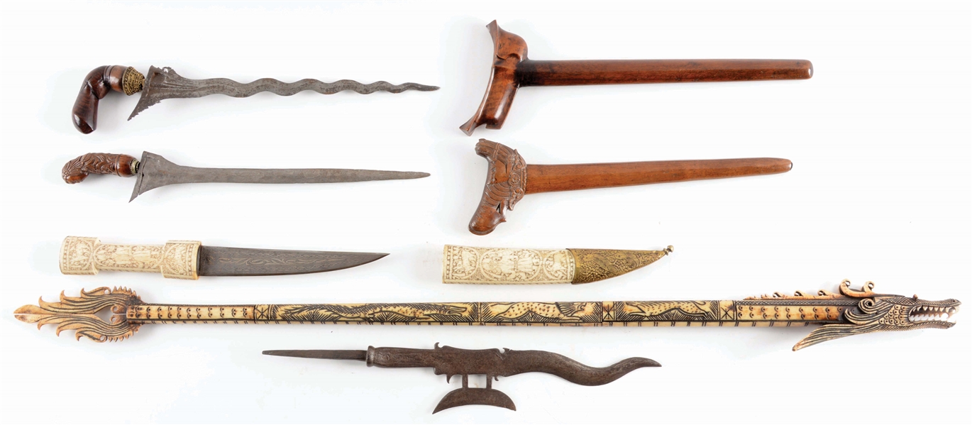LOT OF 5: AN INTERESTING LOT OF FIVE ETHNIC WEAPONS, INCLUDING TWO INDONESIAN KRISSES, A BONE MOUNTED OTTOMAN KANHANJAR, A DRAGON BLOWGUN, AND AN INDONESIAN HALBERD. 