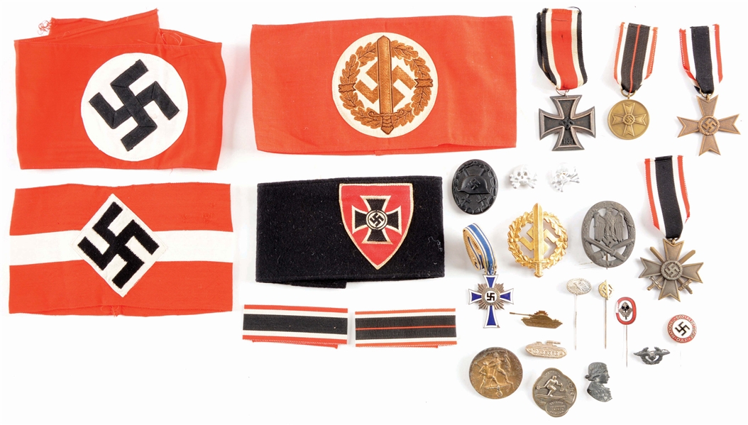 LOT OF 27: THIRD REICH MEDALS, PINS, AND ARMBANDS.