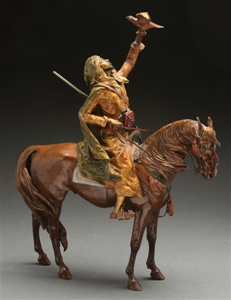 BRONZE SCULPTURE OF ARAB ON HORSEBACK HUNTING WITH A HAWK IN THE MANNER OF FRANZ BERGMAN.