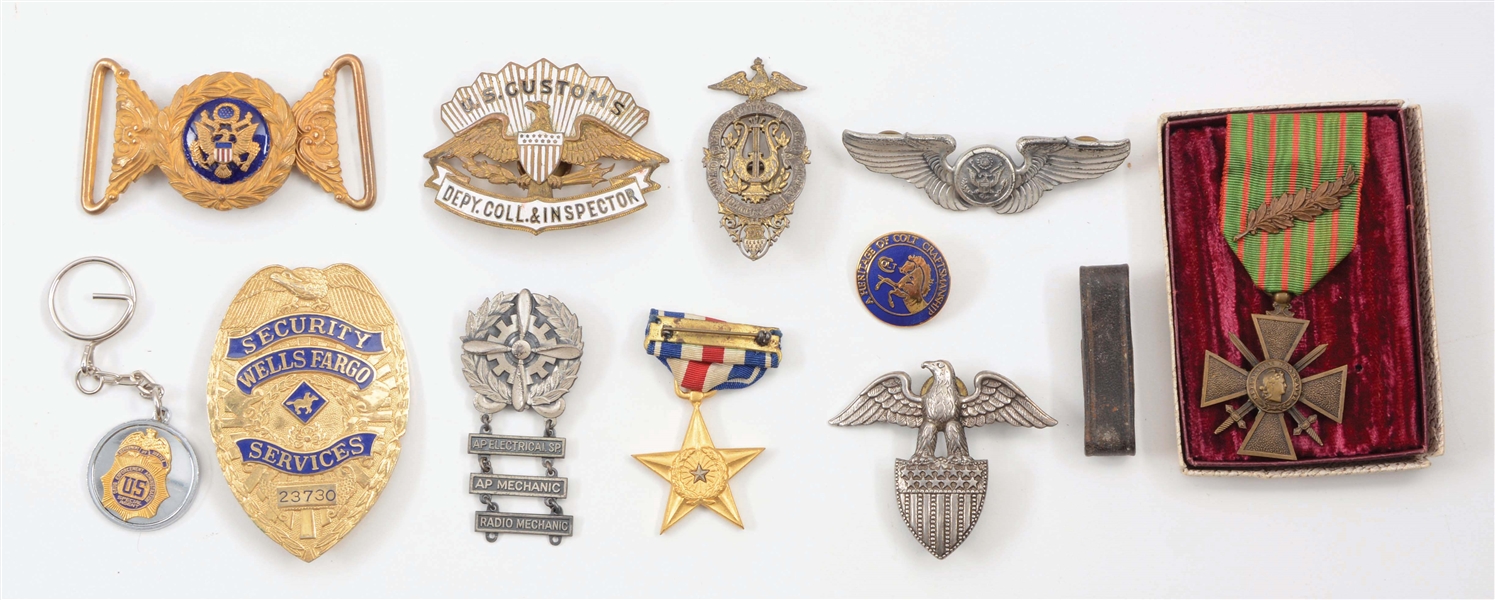 LOT OF 11: MISCELLANEOUS MILITARY MEDALS AND INSIGNIA.