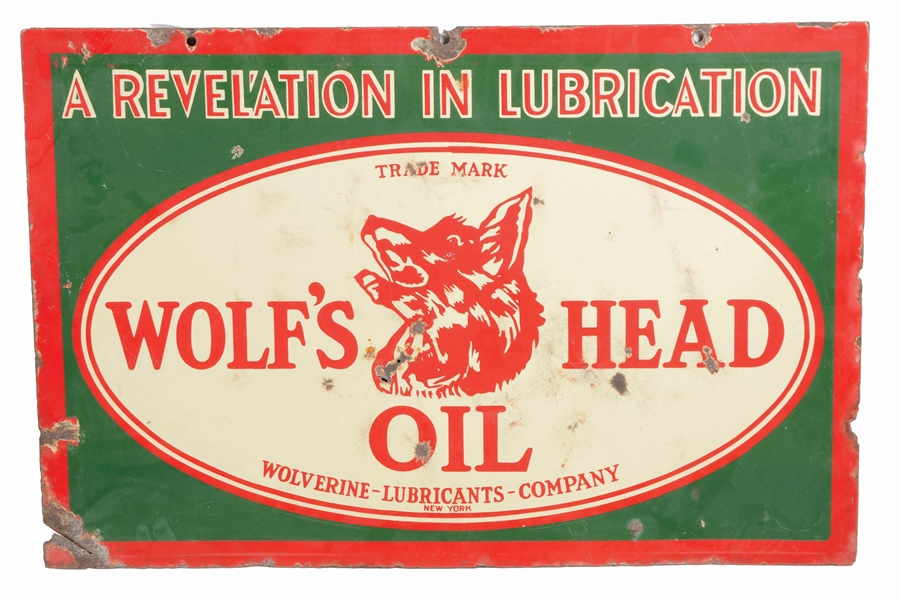 WOLFS HEAD MOTOR OIL PORCELAIN SIGN W/ WOLF GRAPHIC. 