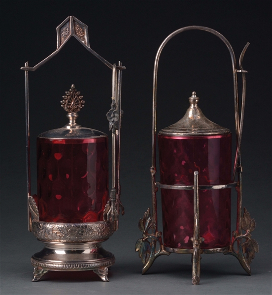 LOT OF 2: CRANBERRY GLASS PICKLE JARS WITH SILVER PLATE HOLDERS.