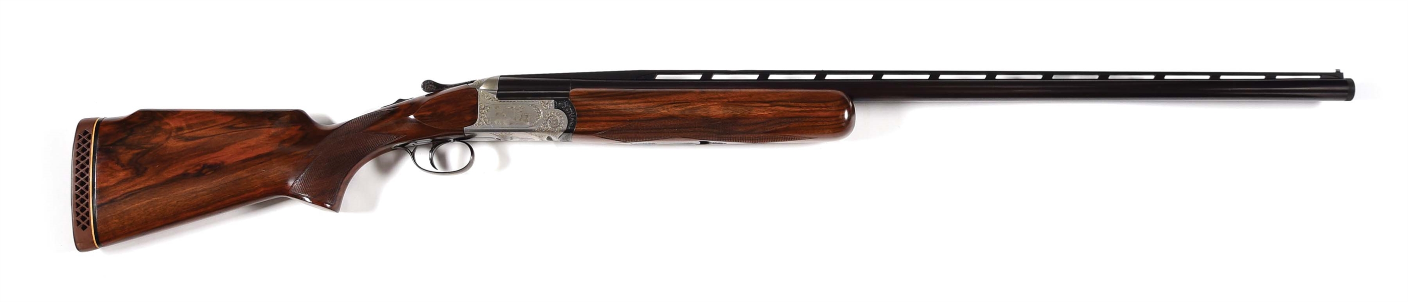 (M) PERAZZI MX 3 SINGLE DOUBLE TRAP SET SHOTGUN ENGRAVED BY GOURNET WITH EXTRA FIELD BARRELS AND STOCKS WITH CASES.