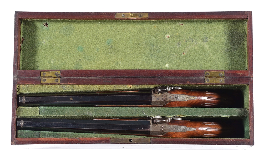 (A) A FINE PAIR OF BELGIAN PERCUSSION SINGLE SHOT TARGET PISTOLS BY BURDON LESAGE, 1845-1855, ARQUEBUSIER ESTAMPES IN A VERY UNUSUAL PERIOD ENGLISH VERTICAL CASE.