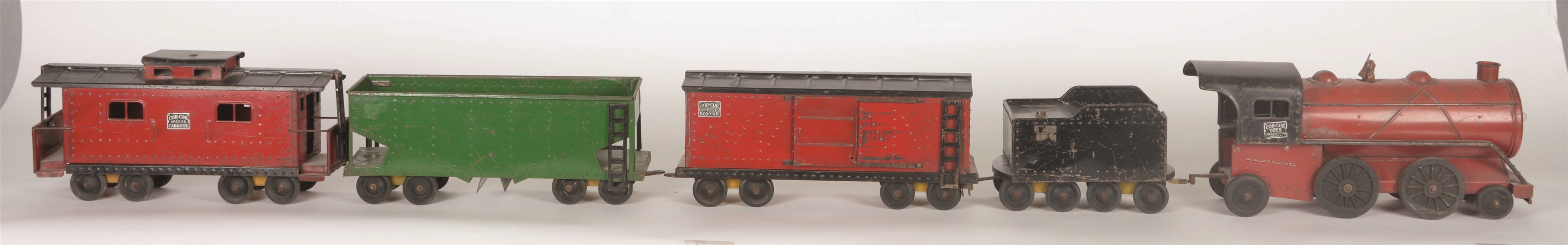 LOT OF 5: PRESSED STEEL CORE-CORE ENGINE, TENDER & THREE FREIGHT CARS.