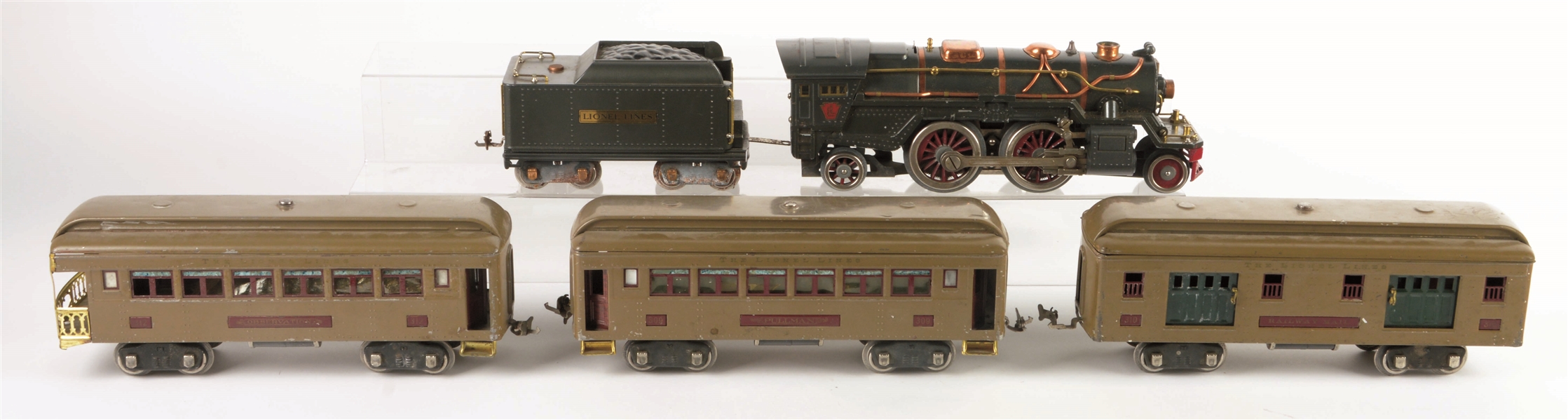 LIONEL 385 WITH THREE PASSENGER CARS.
