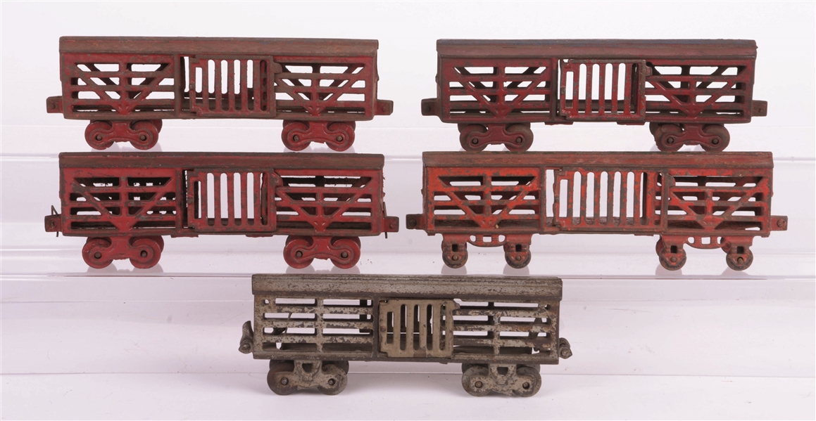 LOT OF FIVE: CAST-IRON FLOOR TRAIN CATTLE CARS.