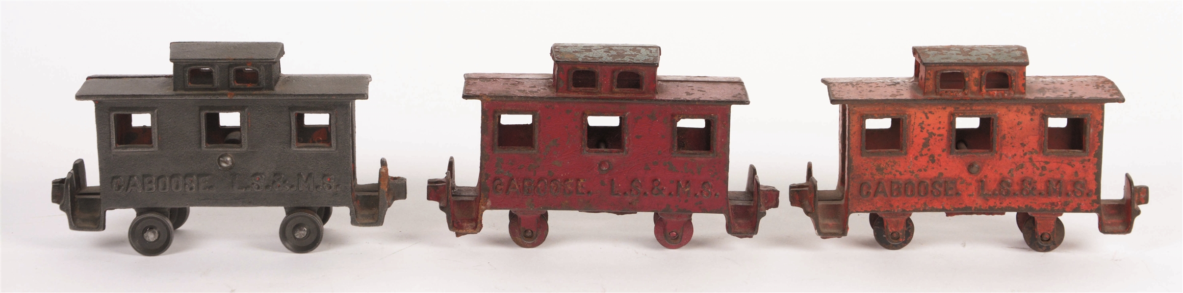 LOT OF 3: CAST-IRON FLOOR TOY CABOOSES BY KENTON.