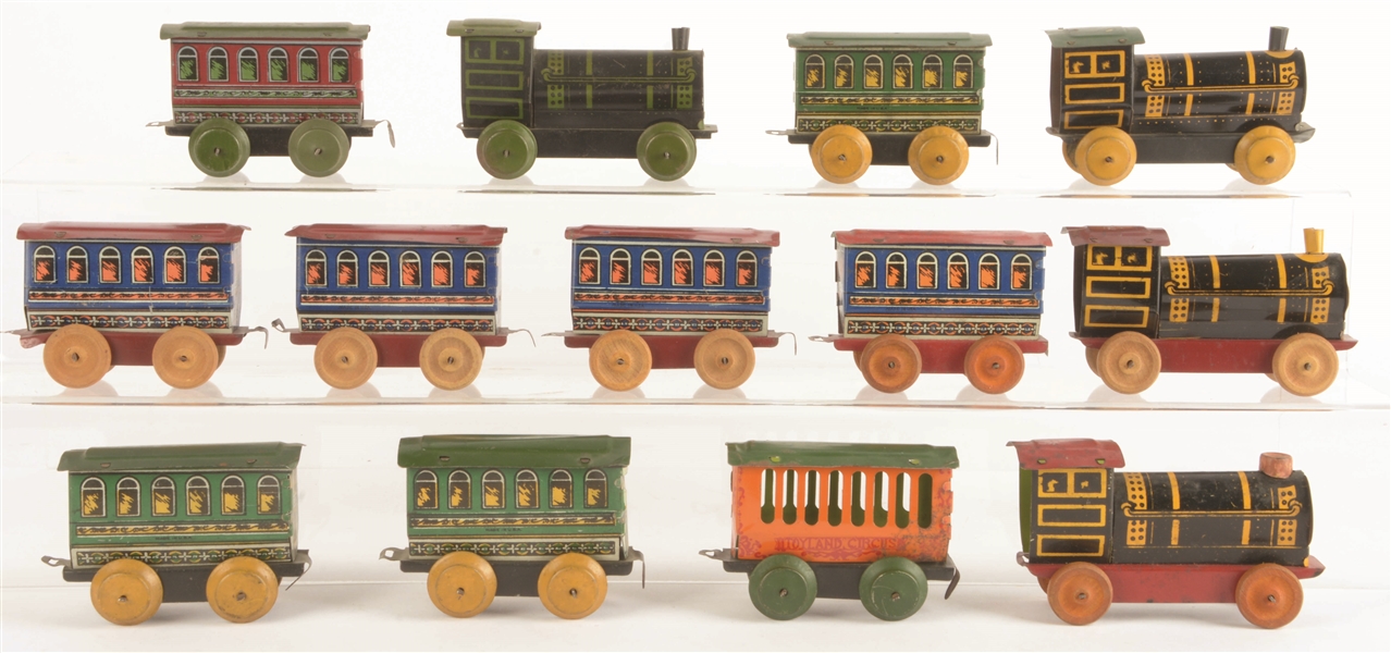 LOT OF 13: ASSORTED OHIO ART TIN-LITHOGRAPHED FLOOR TRAINS.